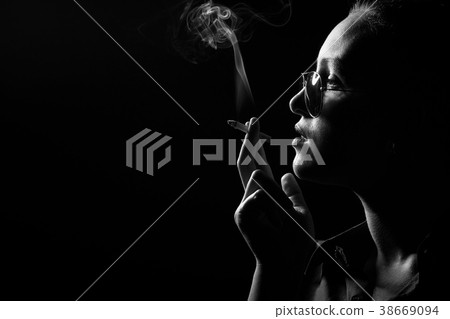woman smoking cigarette woman smoking cigarette 38669094
