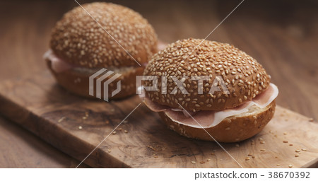 sandwich with prosciutto and cream cheese on wood 38670392