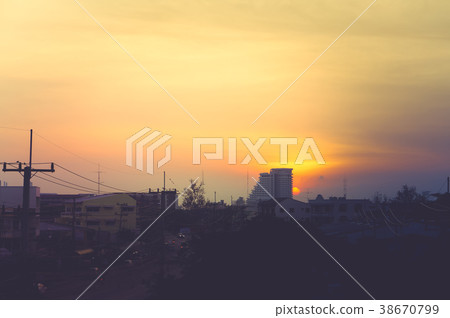 Golden sky and setting sun. and cityview Golden sky and setting sun. and cityview 38670799