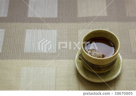 Coffee in a brown cup 38670805