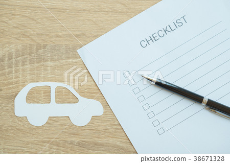 Closed up of checklist with car inspection Closed up of checklist with car inspection 38671328