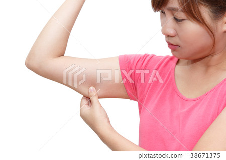 Closed up of woman grabbing skin on upper arm Closed up of woman grabbing skin on upper arm 38671375