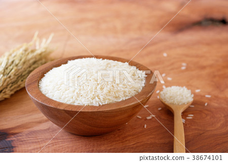 White rice in bowl on wooden background. 38674101
