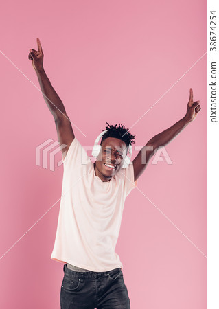 African-American man in headphones listening to African-American man in headphones listening to 38674254