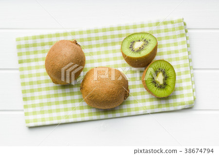 Halved kiwi fruit. 38674794