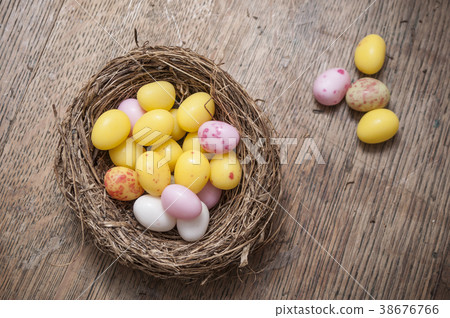 mini colorful easter egggs in nest  38676766