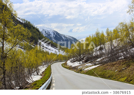 Spring mountains and melting snow 38676915