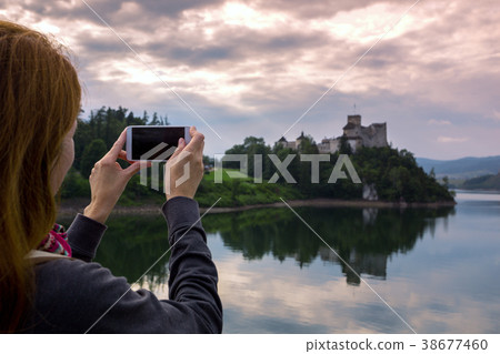 girl making a photo shoot of castle niedzica 38677460