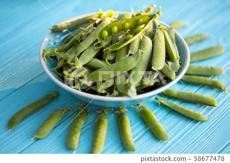 Green peas on a table Green peas on a table 38677478