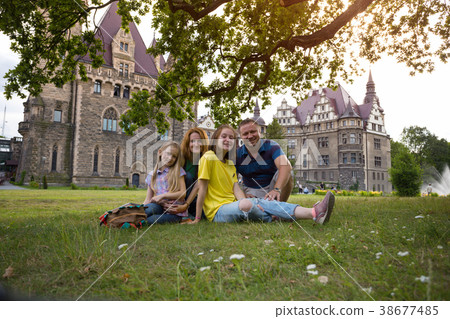 Happy family - mom, dad and two daughters 38677485