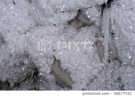 crystals of hoarfrost on an underground rock.. crystals of hoarfrost on an underground rock.. 38677582