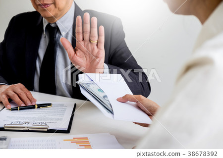 Businessman refusing or rejecting money in the envelope - anti b 38678392