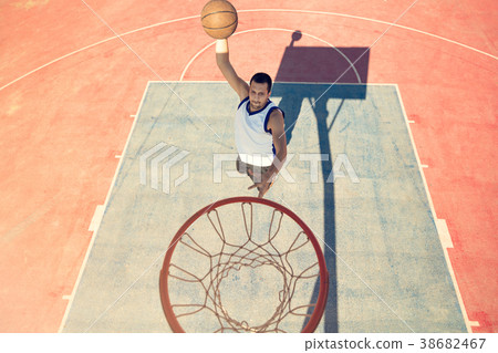 High angle view of basketball player dunking 38682467