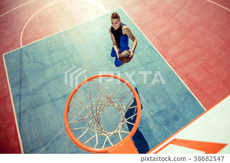 High angle view of basketball player dunking 38682547