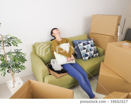 Woman tired to rest in preparation for moving 38682827