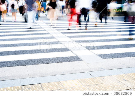 People walking on a pedestrian crossing 38682869
