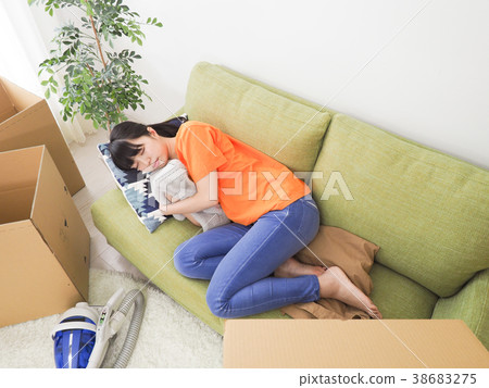 Woman tired to rest in preparation for moving 38683275