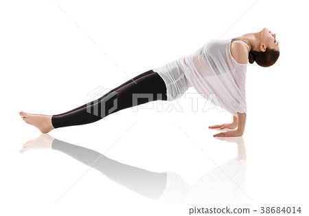 Young woman doing yoga exercise on the floor. 38684014
