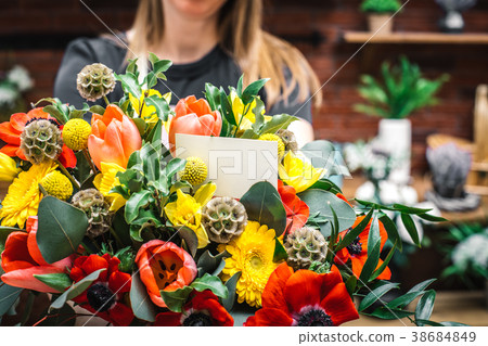 Florist presenting amazing lush bouquet 38684849