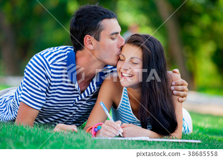 Young in love couple with in blue clothing 38685558
