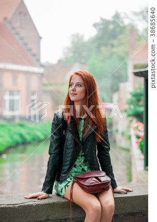 Young redhead girl rest on the street in Brugge 38685640