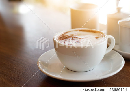 Coffee cup on wooden table background 38686124