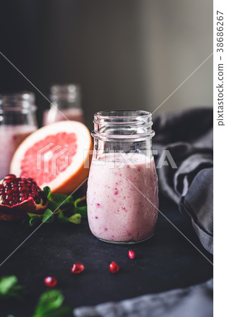 Pink berry smoothie with pomegranate, acai and 38686267