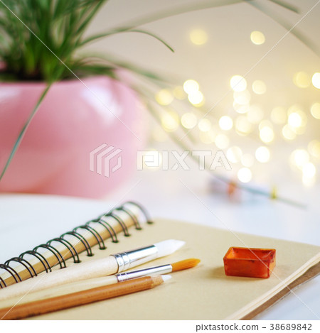 Blank notepad with watercolor and brushes 38689842