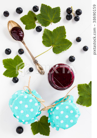 Homemade black currant jelly in the glass jars 38690159