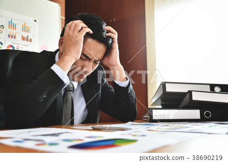 Businessman having headache. Businessman having headache. 38690219