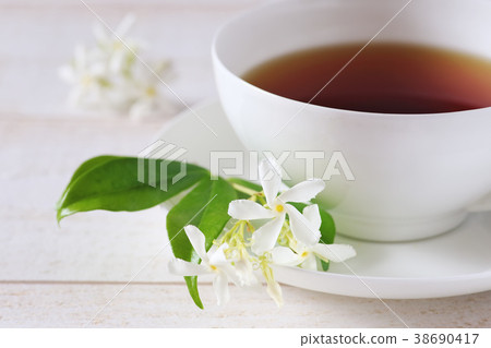 Jasmine tea in a white bone china cup Jasmine tea in a white bone china cup 38690417
