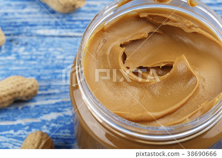 peanut paste on a wooden background peanut paste on a wooden background 38690666
