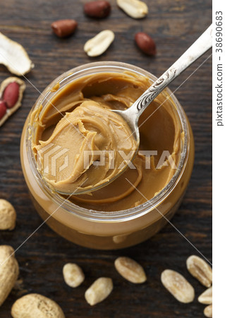 peanut butter in an open jar peanut butter in an open jar 38690683
