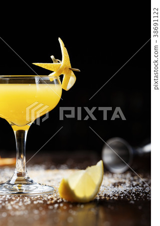 cocktail decorated with lemon cocktail decorated with lemon 38691122