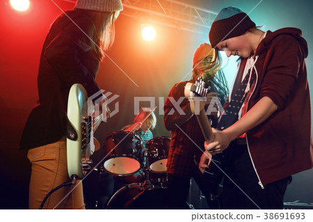 Teenagers are playing rock. Teenagers are playing rock. 38691693