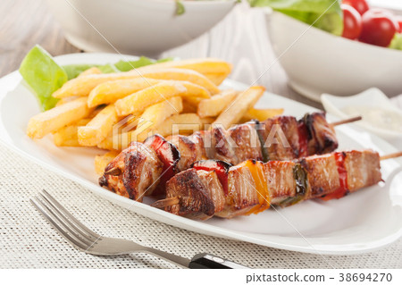 Grilled shashlik with french fries 38694270