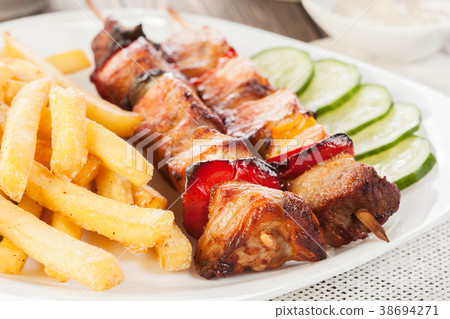 Grilled shashlik with french fries 38694271