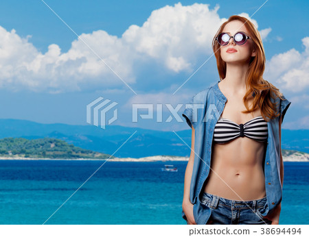 girl in bikini and sunglasses on tropical summer background girl in bikini and sunglasses on tropical summer background 38694494