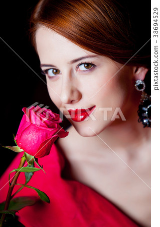 woman in red Victorian epoch clothes with red rose woman in red Victorian epoch clothes with red rose 38694529