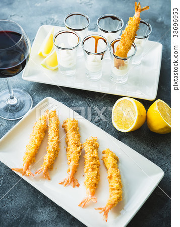 King Prawn served with sauce and lemon. Sea food King Prawn served with sauce and lemon. Sea food 38696953