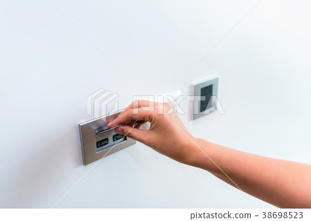 Close up of female hand inserting key card  38698523