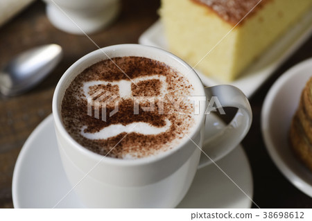 man face in a cup of cappuccino 38698612