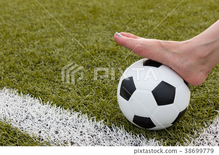 girl foot on the soccer ball on green field girl foot on the soccer ball on green field 38699779