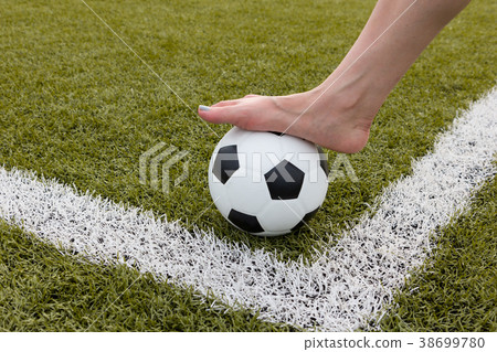 girl foot on the soccer ball on green field girl foot on the soccer ball on green field 38699780