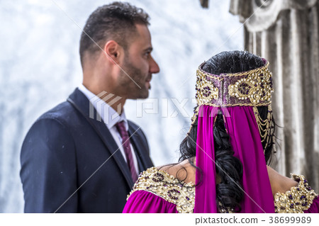 Happy couple in traditional turkish wedding dress Happy couple in traditional turkish wedding dress 38699989