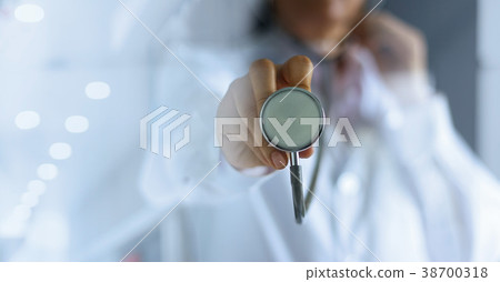 Doctor with stethoscope in hands in hospital Doctor with stethoscope in hands in hospital 38700318