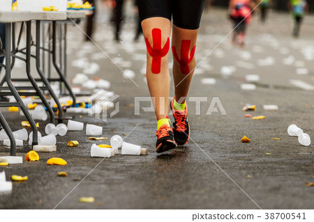 legs female runner red kinesio tape legs female runner red kinesio tape 38700541