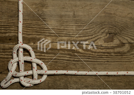 sea knot heart wooden background 38701052