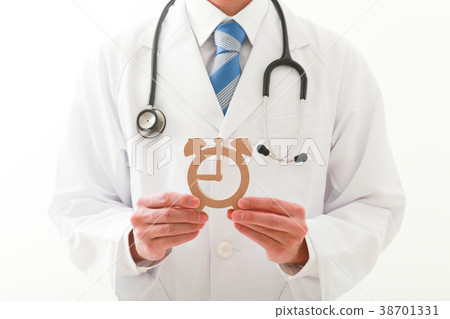 A man in a white coat with a watch A man in a white coat with a watch 38701331