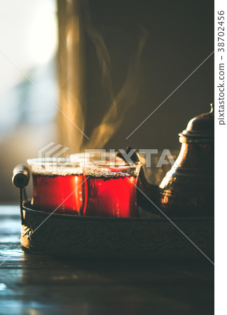 Freshly brewed traditional black tea in turkish 38702456